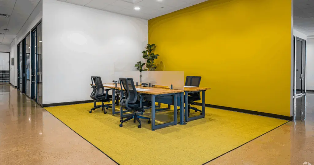 Dedicated desk workspace at Strive Coworking Workspaces with personal desks, privacy panels, and a quiet, professional setting.