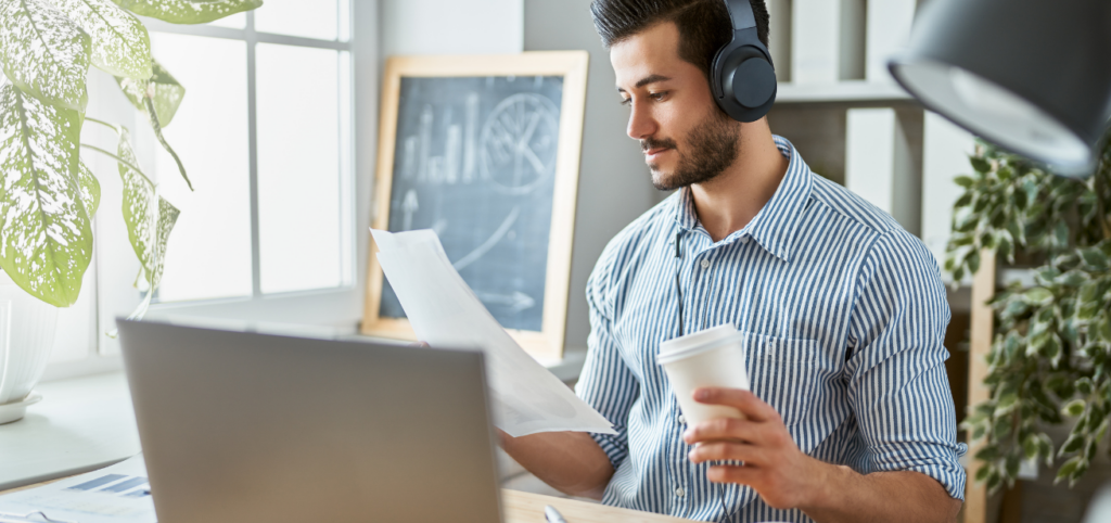 A man working with headphones noise-canceling headphones on