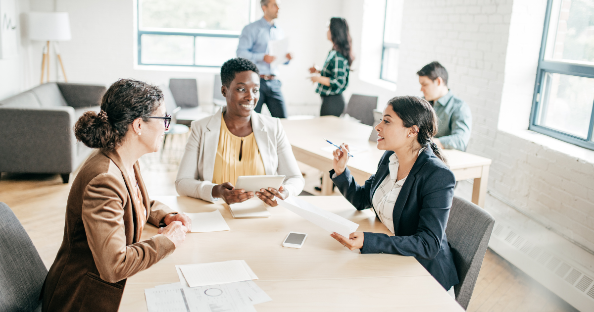 Professionals networking in a coworking space.