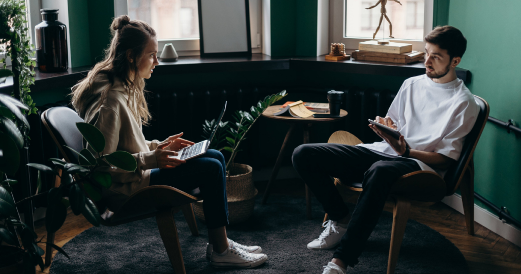 Two professional working in a coworking space