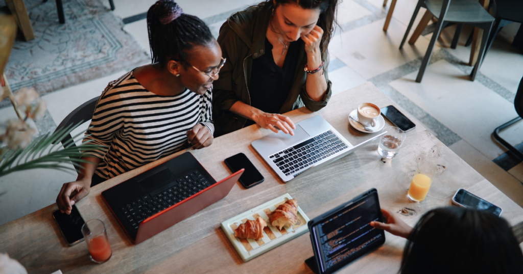 Members of a flexible office space collaborating in a shared workspace.