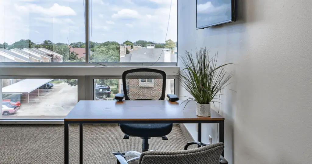Private office in North Dallas at Strive Workspaces with desk workspace and large window views.