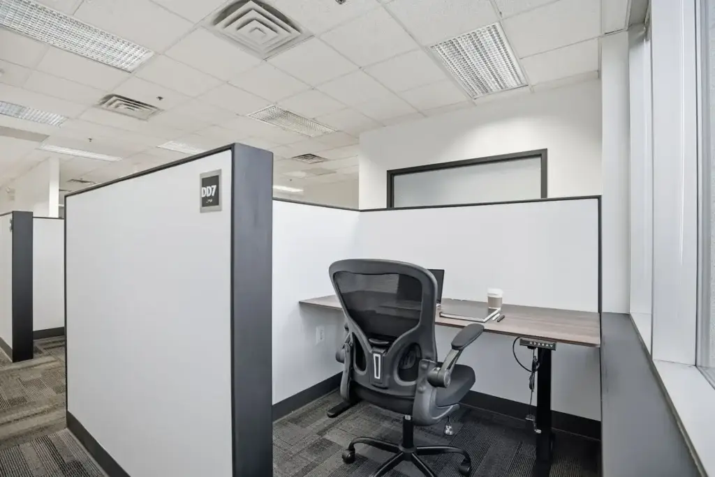 Private dedicated desk in Princeton NJ coworking space with monitor, chair, and workspace near Route 1 corridor