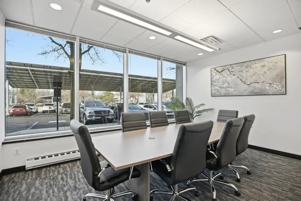Professional meeting room in Princeton NJ near Princeton University with conference table and presentation screen