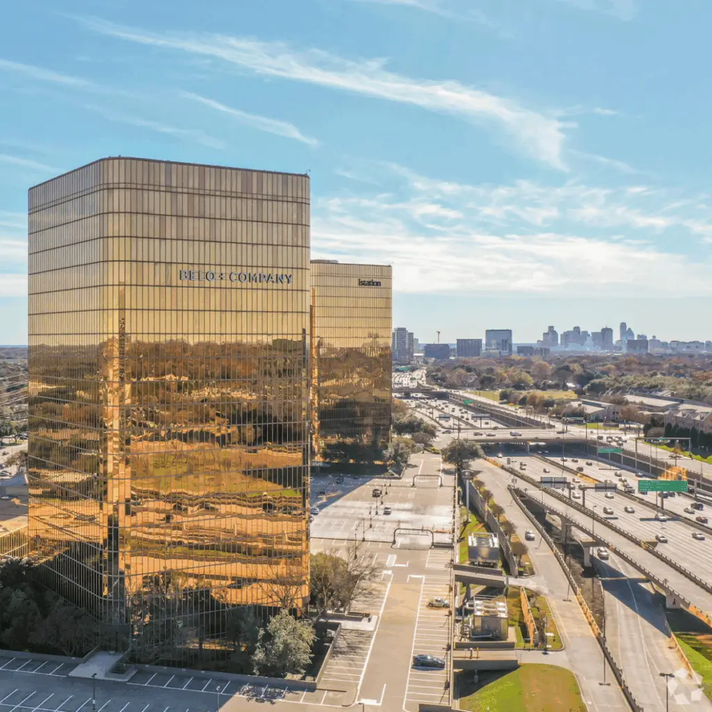 Flex at The Gild in Dallas offering dedicated desk coworking in a modern glass office tower near Central Expressway.