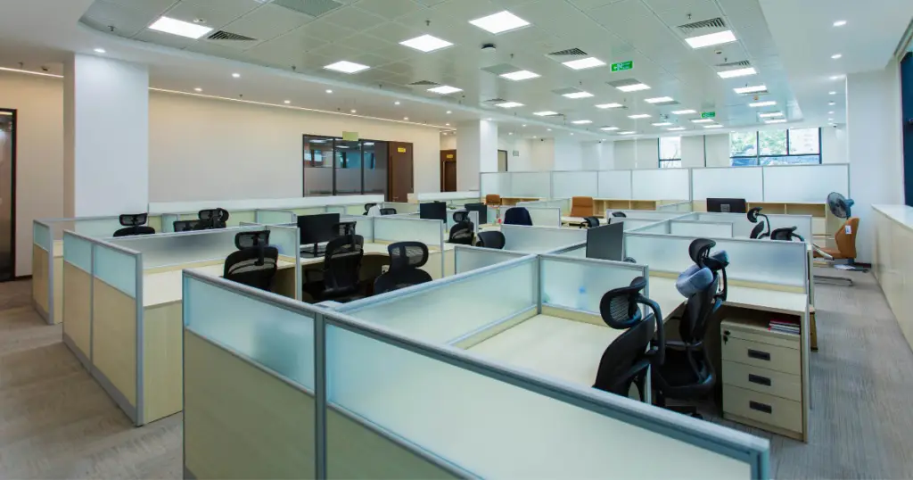 Traditional office space with cubicles illustrating the cost of traditional office space
